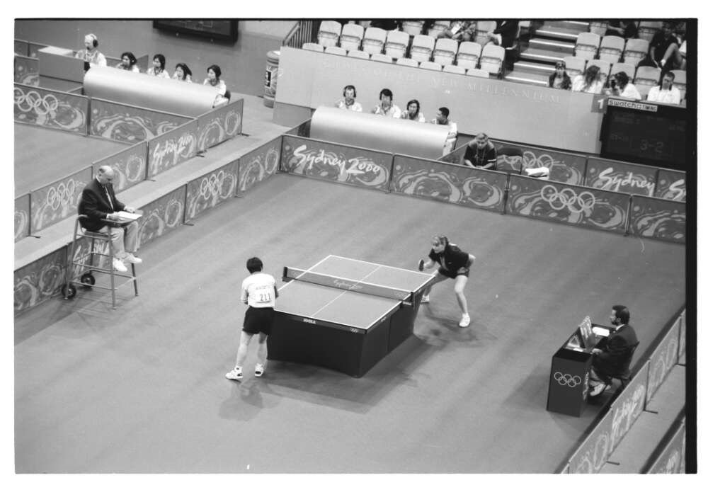 two players playing table tennis at Sydney Olympics